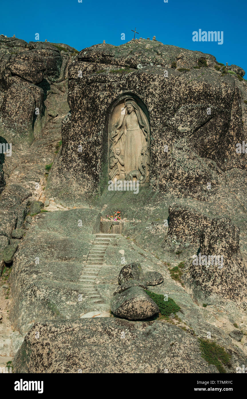 Image of Our Lady of the Good Star carved in rocky cliff at the highlands of Serra da Estrela. The highest mountain range in continental Portugal. Stock Photo
