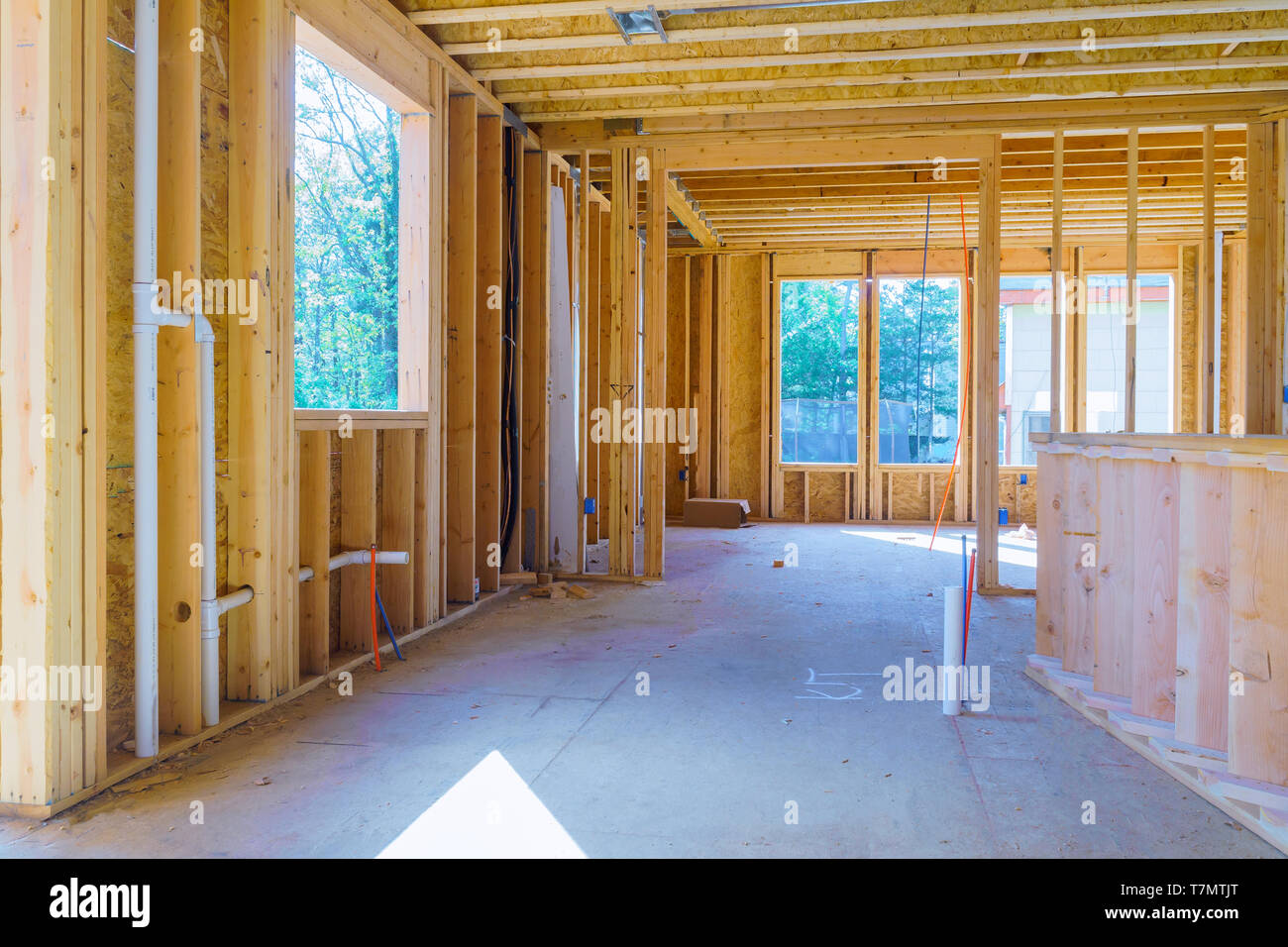 Timber frame house, stick built home under construction with wooden