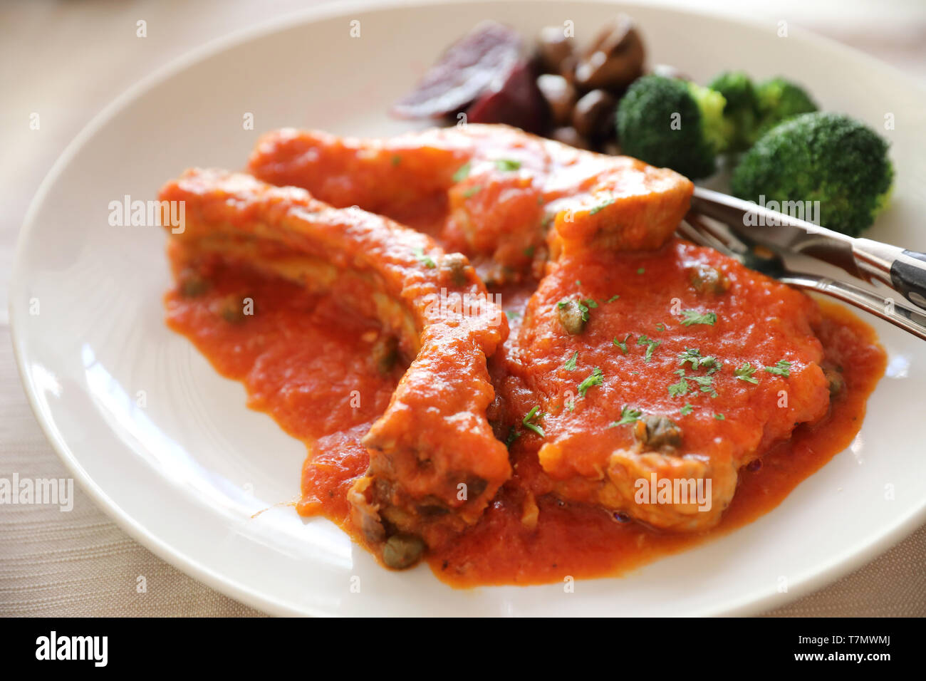 Pork chop steak with tomato sauce and mushroom , Italian food Stock Photo -  Alamy