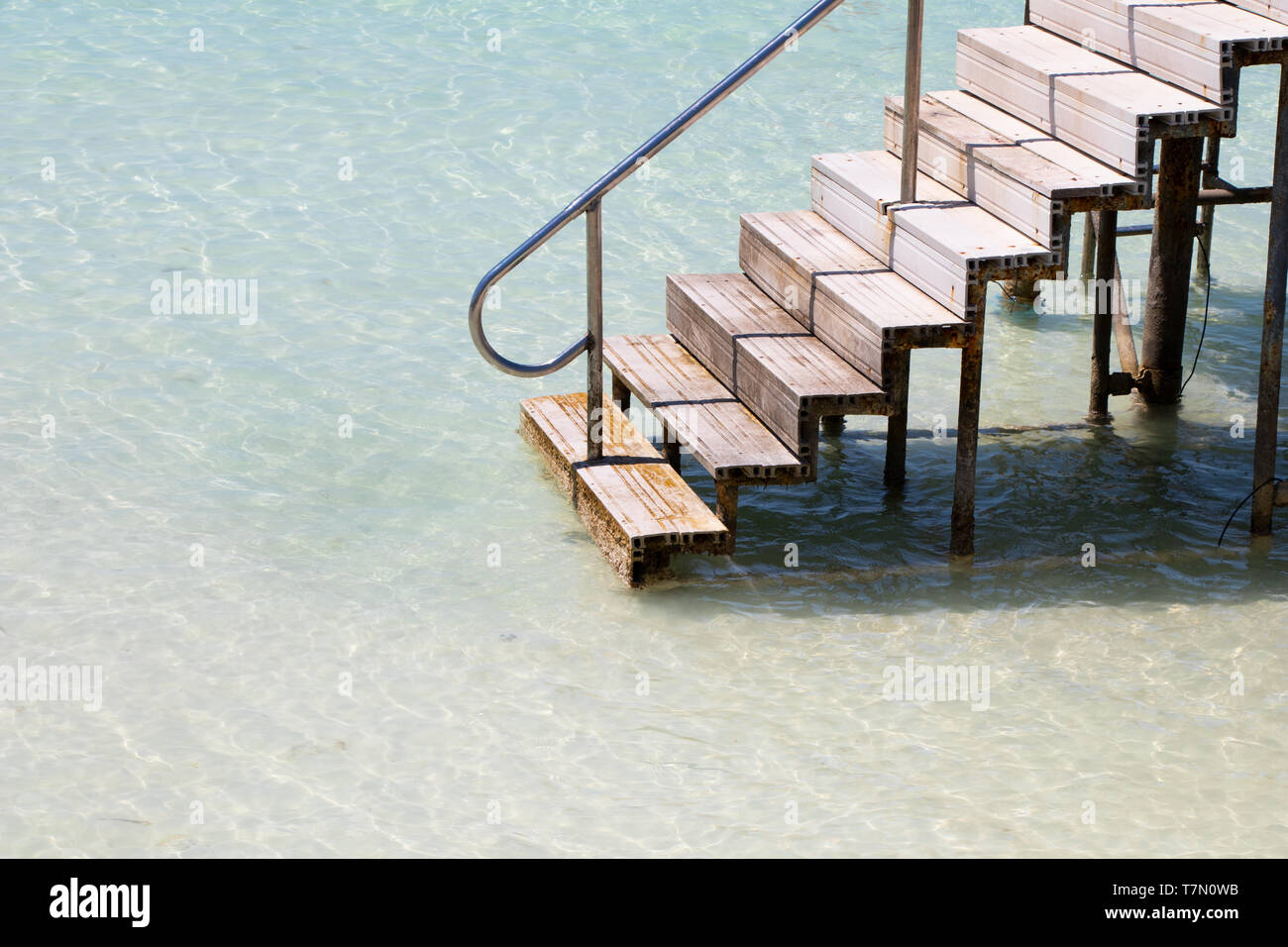 Stairs leading into turquoise Caribbean water Stock Photo