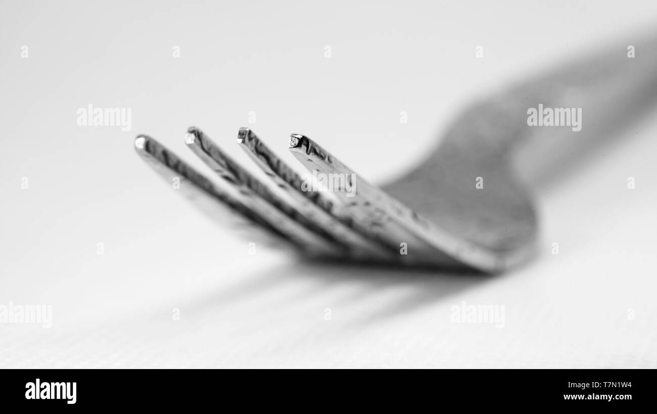 close up of fork lying on table Stock Photo