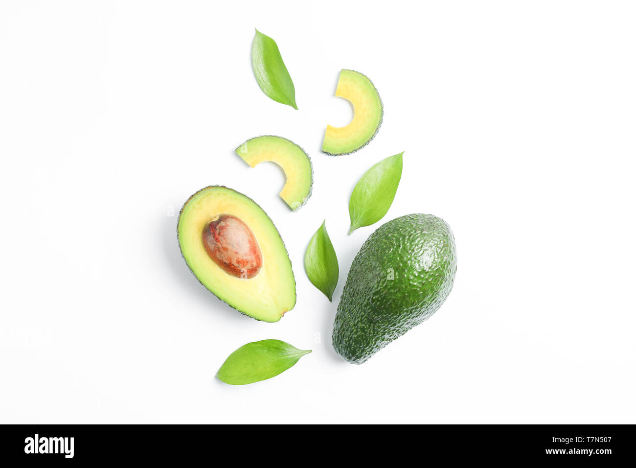 Flat lay composition with ripe avocados on white background, space for ...