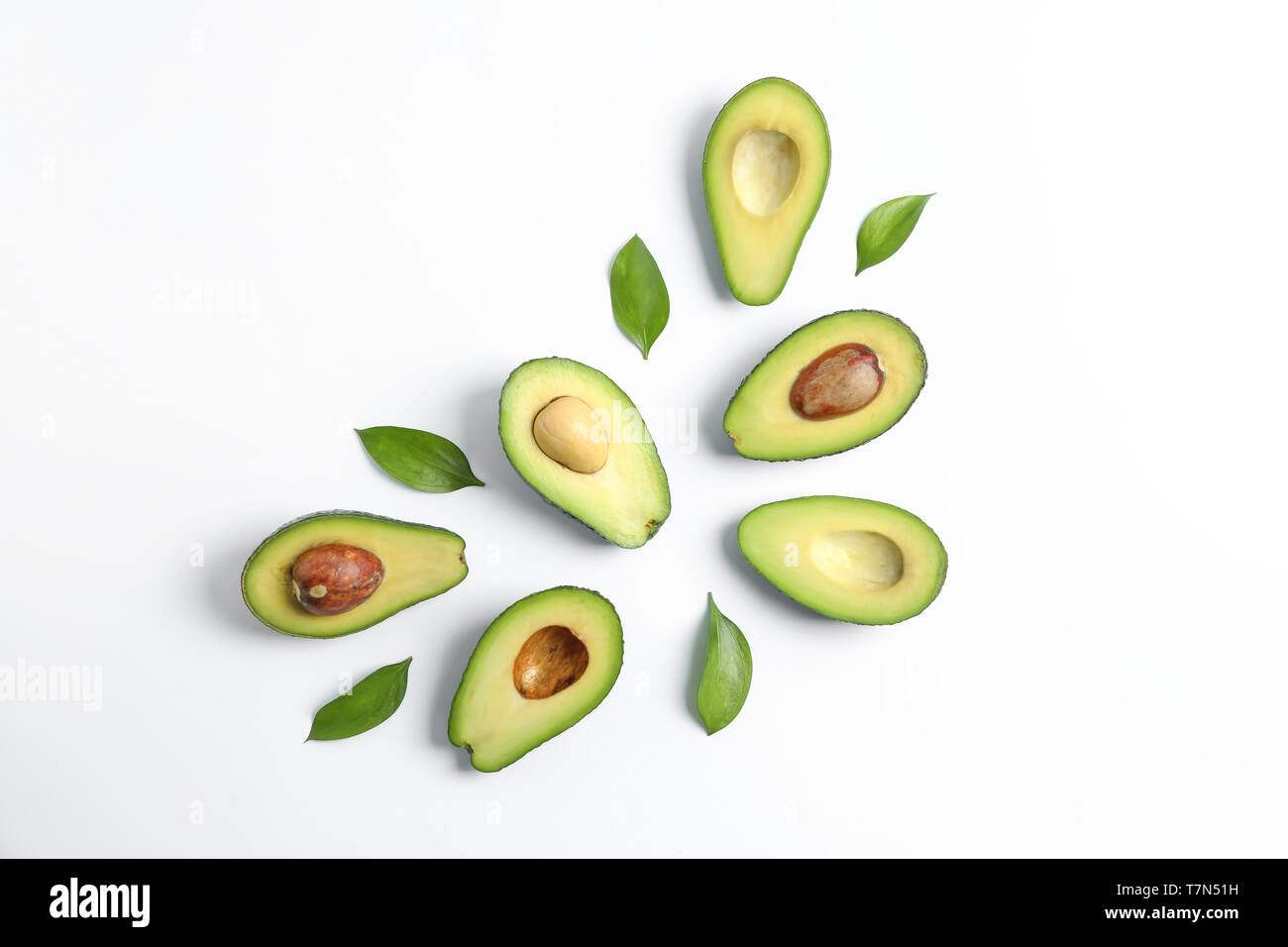Flat lay composition with ripe avocados on white background, space for ...