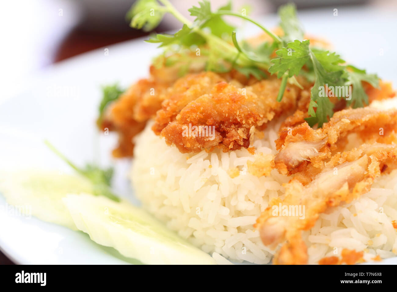 Thai food gourmet fried chicken with rice , khao mun kai tod in wood background Stock Photo