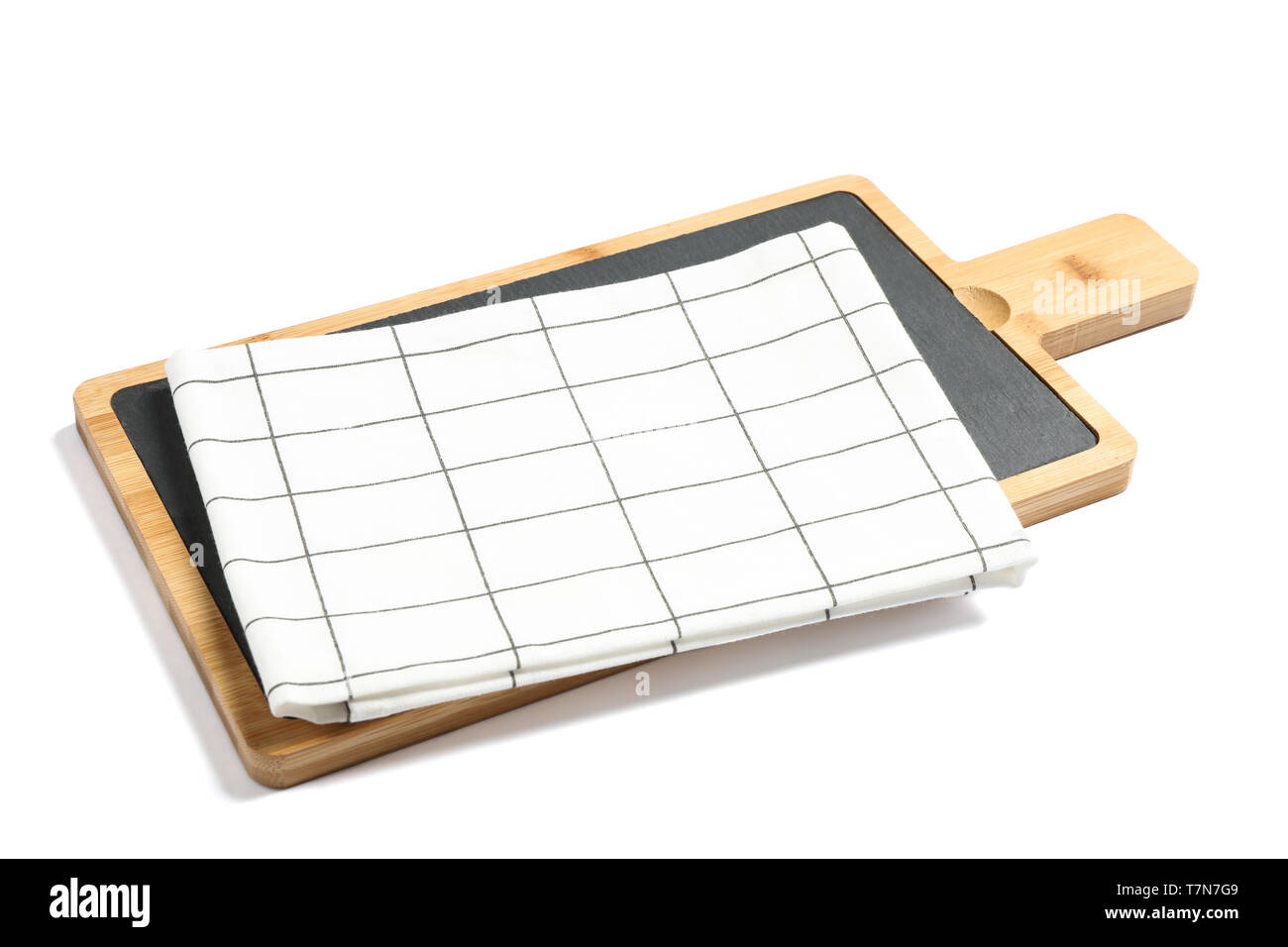 Cutting board with kitchen towel isolated on white background Stock Photo