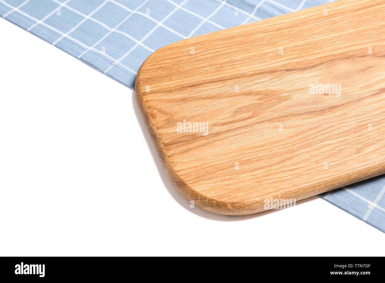Cutting board with kitchen towel isolated on white background Stock Photo