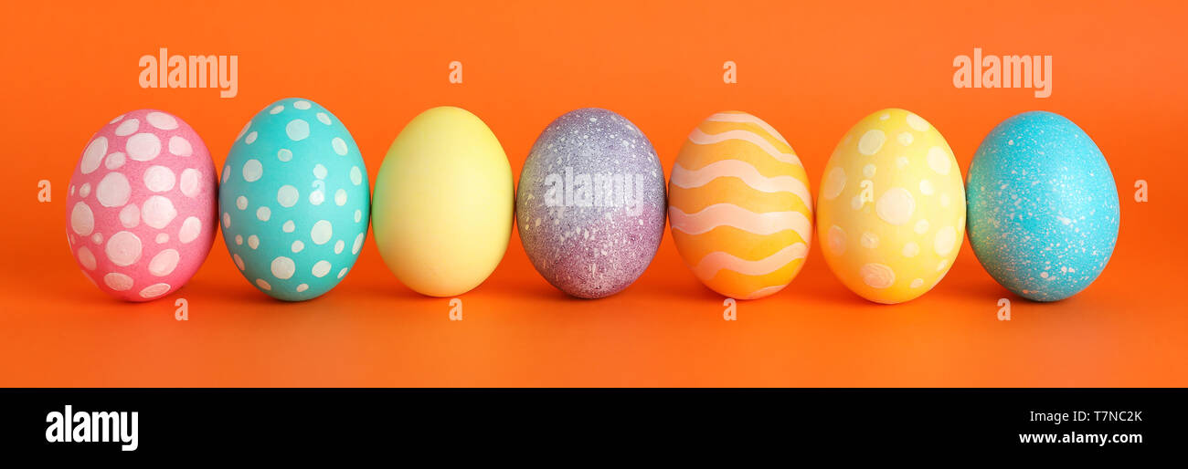 Decorated Easter eggs on color background. Space for text Stock Photo ...