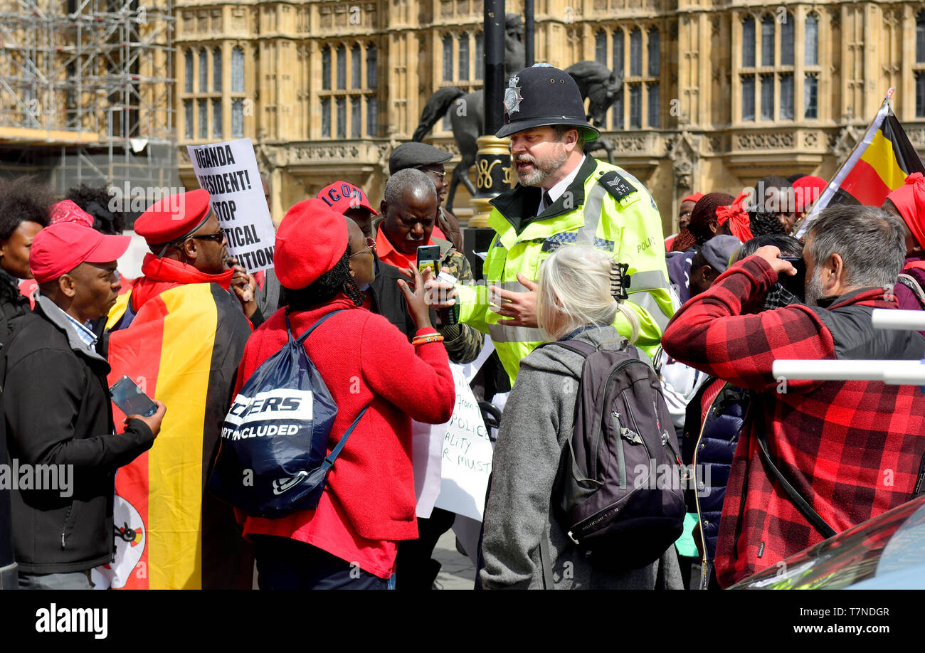 London, England, UK. Police interacting with protesters (against the Ugandan regime) in Westminster, May 2019 Stock Photo