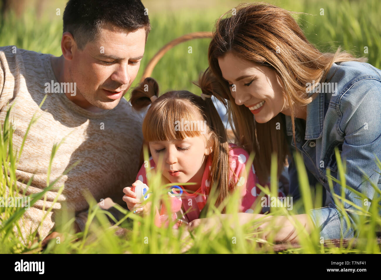 Woman Lying Grass Blowing Bubbles Hi Res Stock Photography And Images