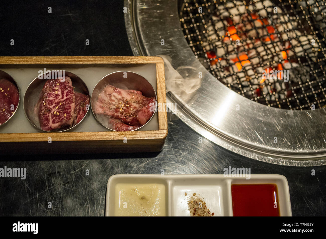 Korean barbecue table set in a restaurant in Tokyo, Japan Stock Photo