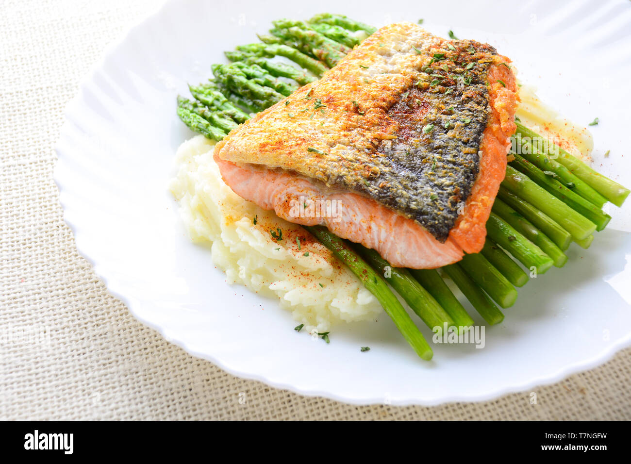 Grilled Salmon Garnished With Asparagus And Herbs And Mashed Potatoes Served On White Plated Stock Photo Alamy