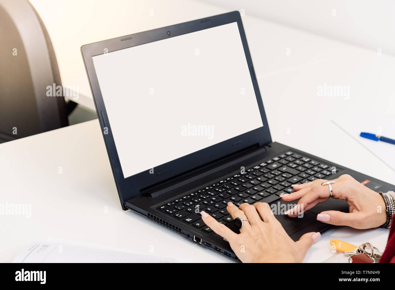 Mockup image of a woman using laptop with blank white screen Stock ...