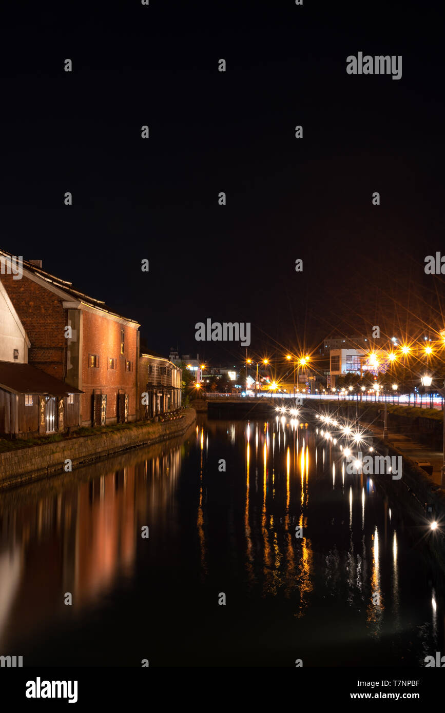 Landscape view of Otaru canals and warehouse at night in Hokkaido Japan. Here is a famous landmark of Otaru city. Stock Photo