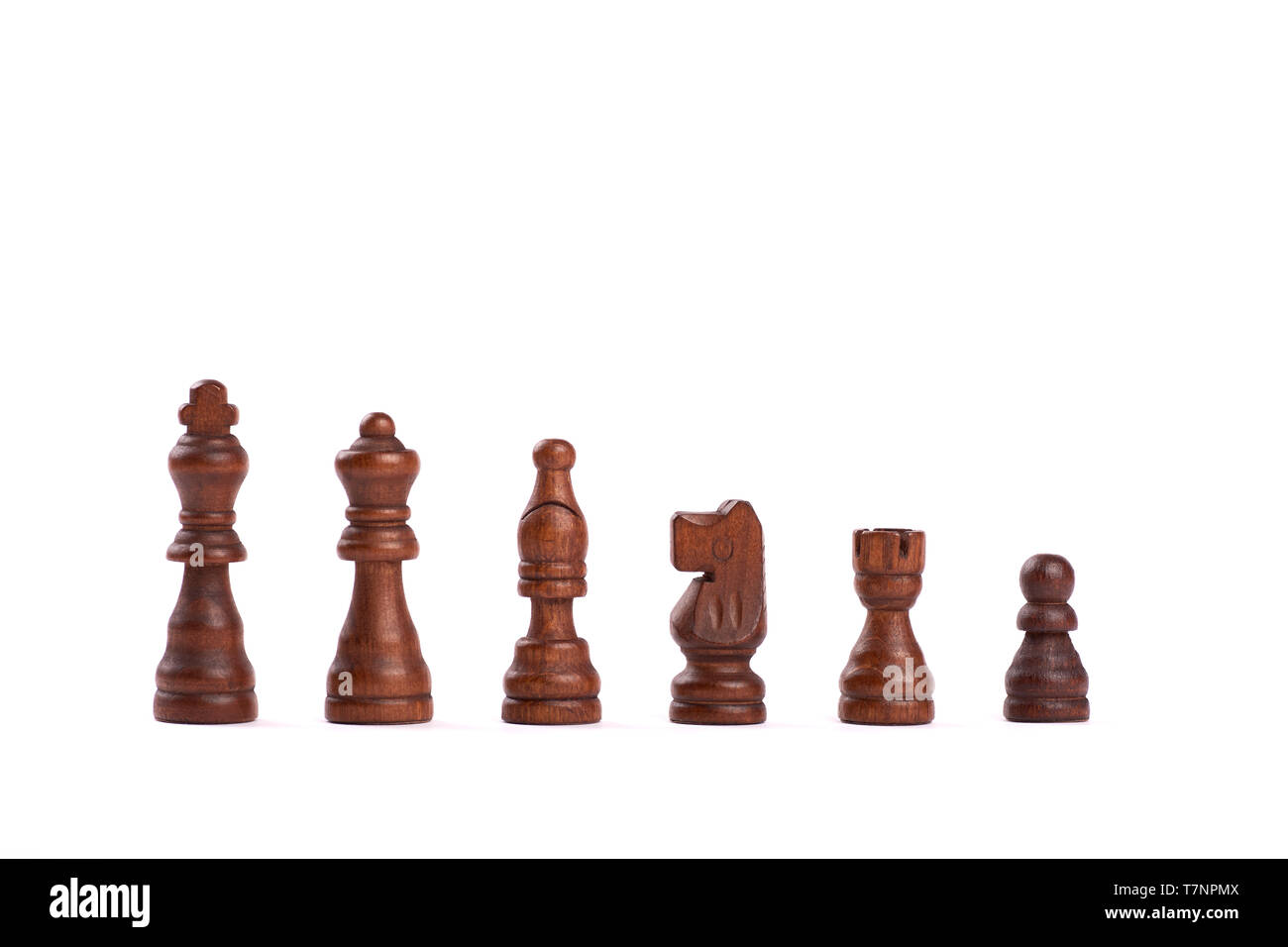 Set of black wooden chess figures standing in a row isolated on white background Stock Photo