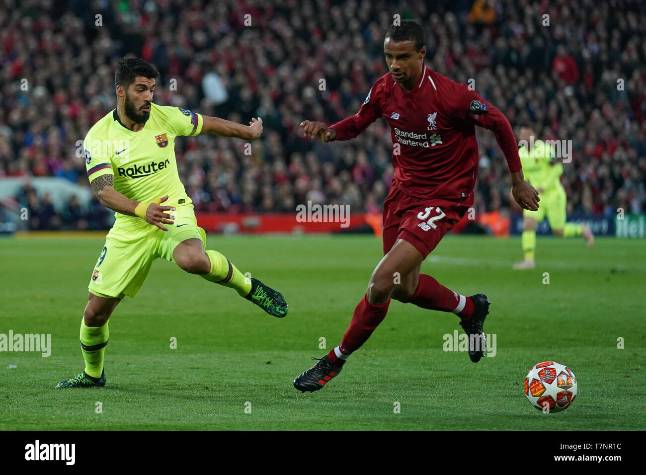 Liverpool's Joel Matip under pressure from  Barcelona's Luis Suarez  7th Mayl 2019 , Anfield Stadium, Liverpool, England;  UEFA Champions League Semi Final, Second Leg, Liverpool FC vs FC Barcelona   Credit: Terry Donnelly/News Images Stock Photo