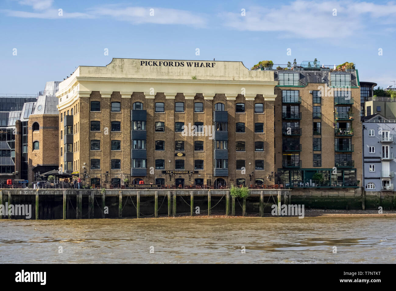LONDON, UK - JULY 04, 2018:  Pickford's Wharf Building and Old Thameside Inn seen from the River Thames with sign Stock Photo