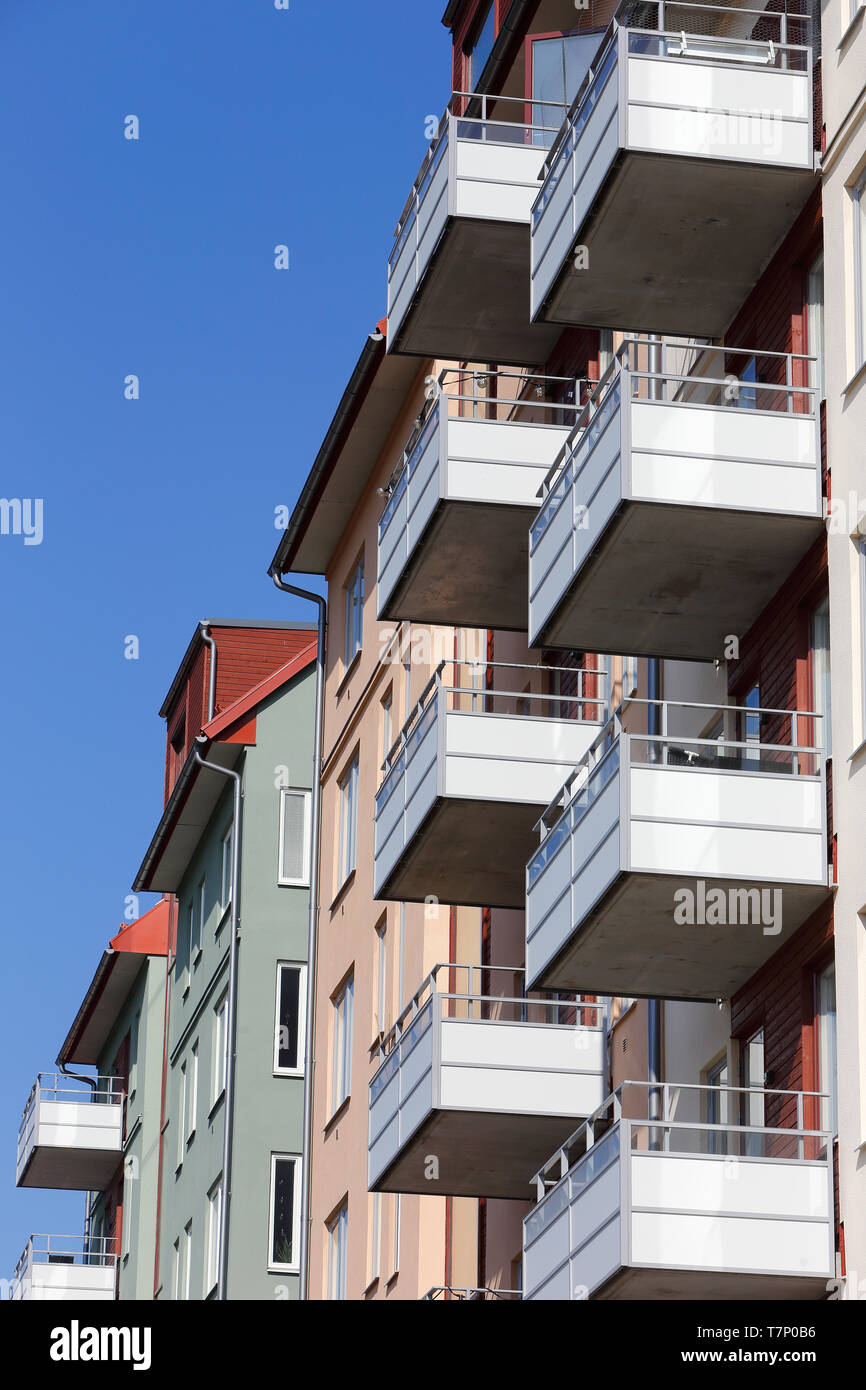 Close-up of a modern multi-story apartment residential building with balconies. Stock Photo
