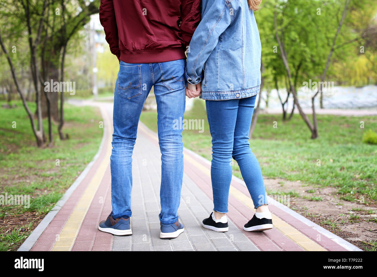 Teen couple walking holding hands hi-res stock photography and images ...
