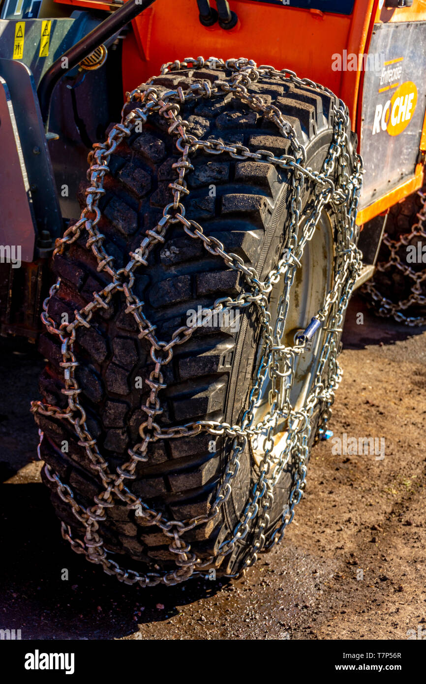 Metal snow chains on wheel of a snow removal vehicle Stock Photo Alamy