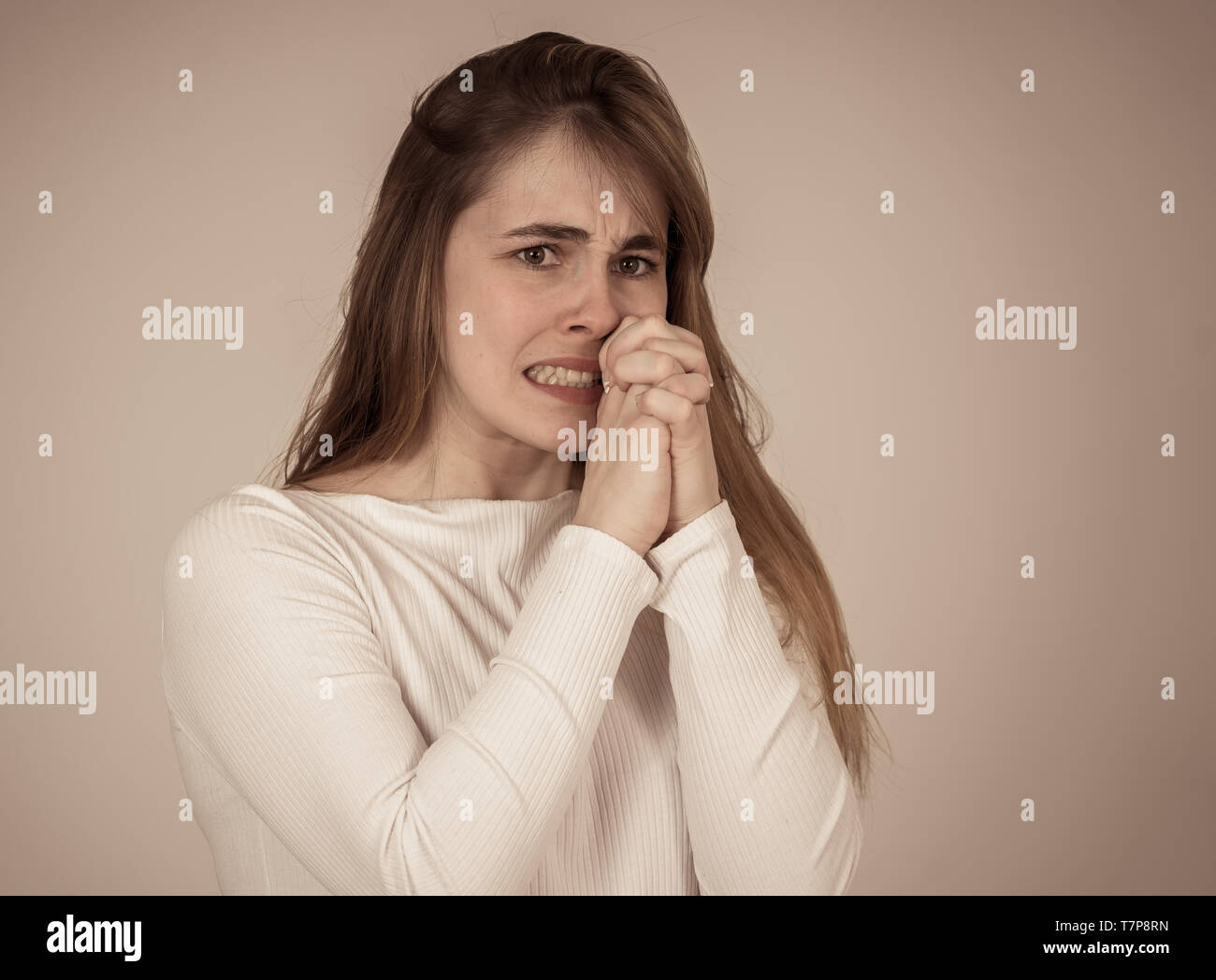 Close up portrait of young teen woman feeling afraid and shocked ...