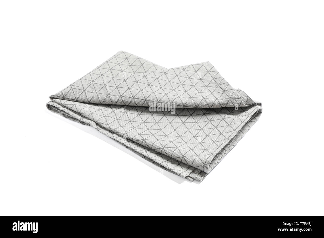 Folded grey napkin isolated on white background Stock Photo