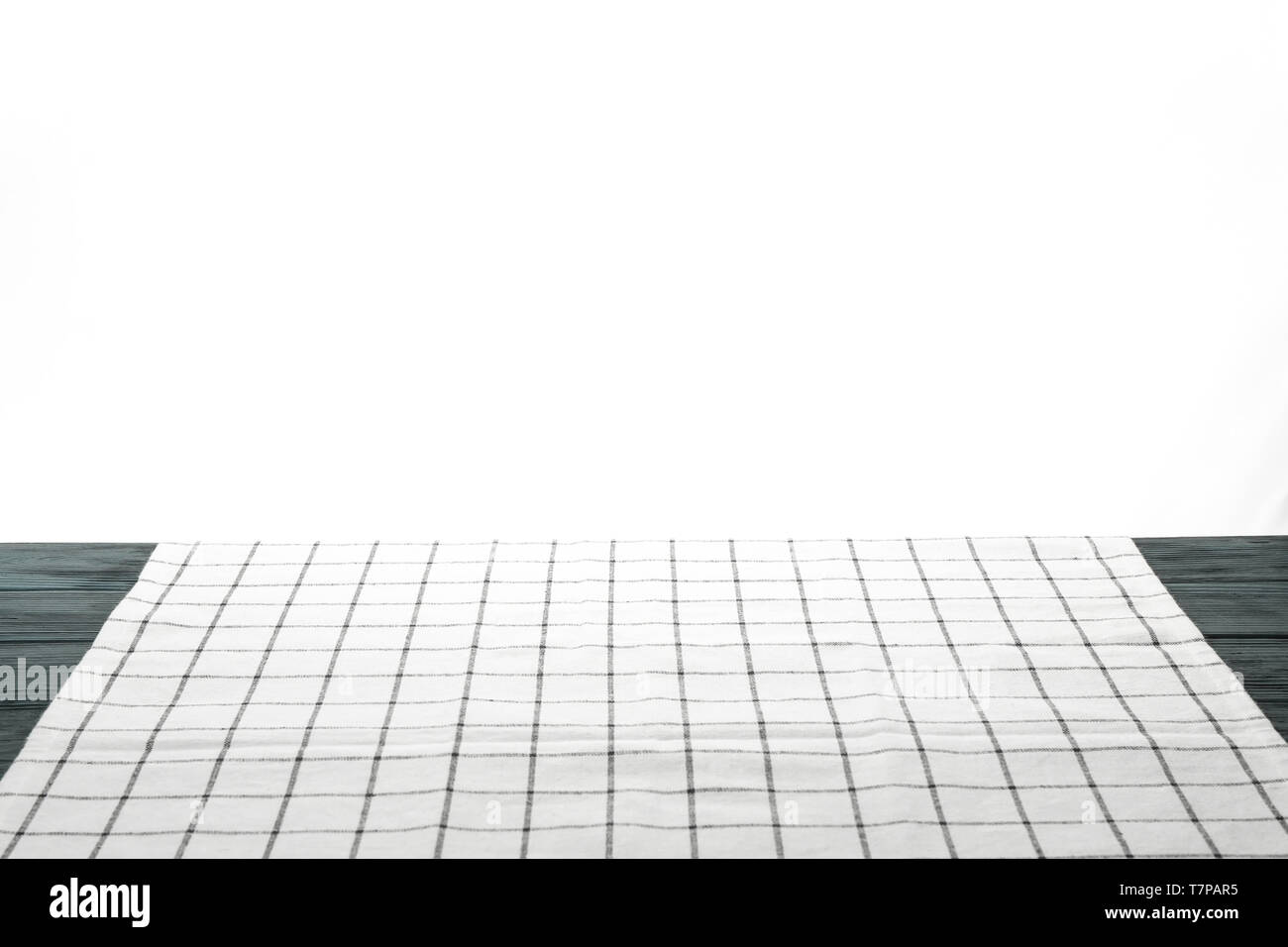 Fabric napkin on table against white background, space for text Stock Photo