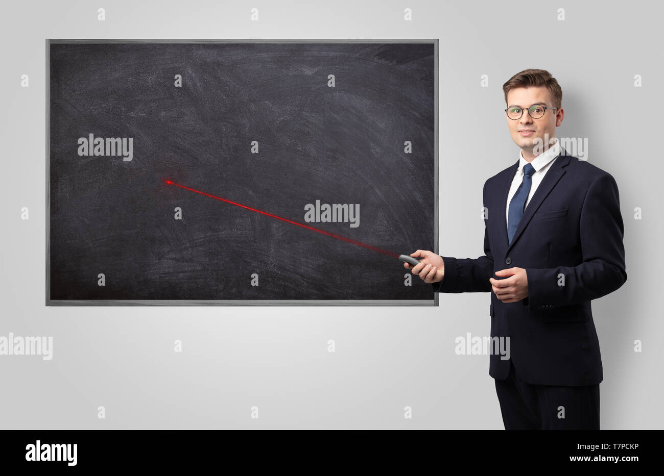 Handsome young teacher with laser pointer teaching Stock Photo Alamy