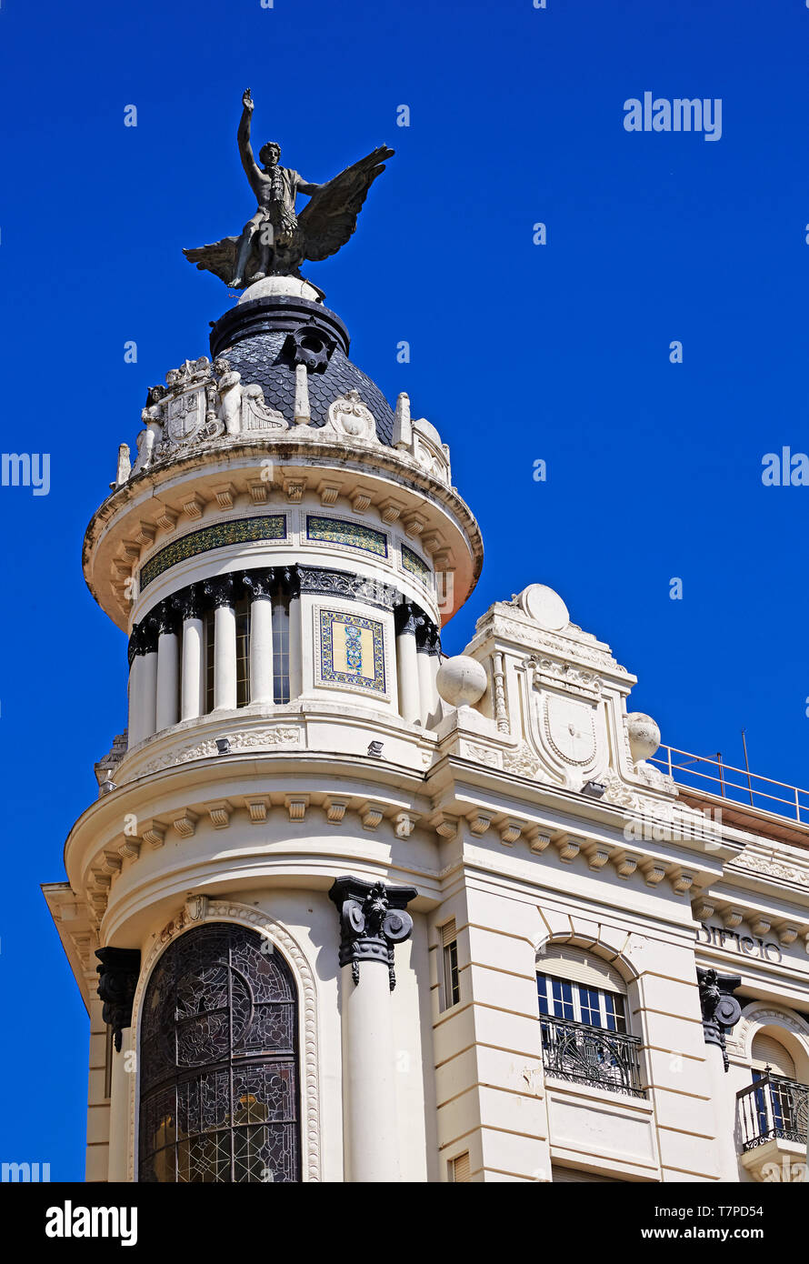 Architectural detail of the 'Union and the Phoenix' building in the central 'Plaza de las Tendillas' against blue skies Stock Photo