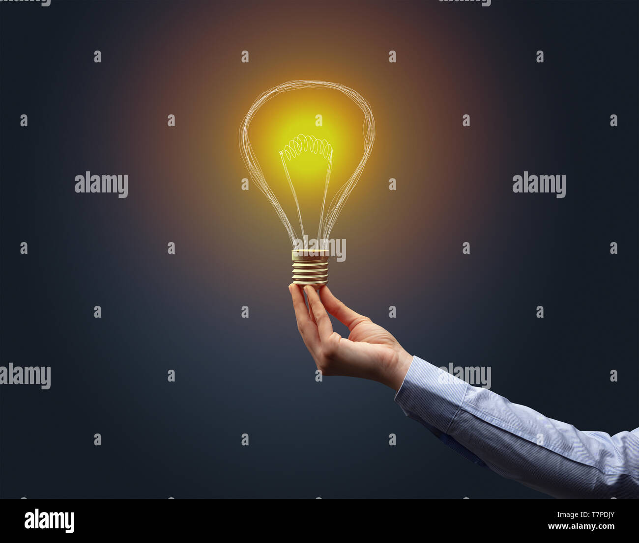 Hand holding light bulb on dark background. New idea concept Stock ...