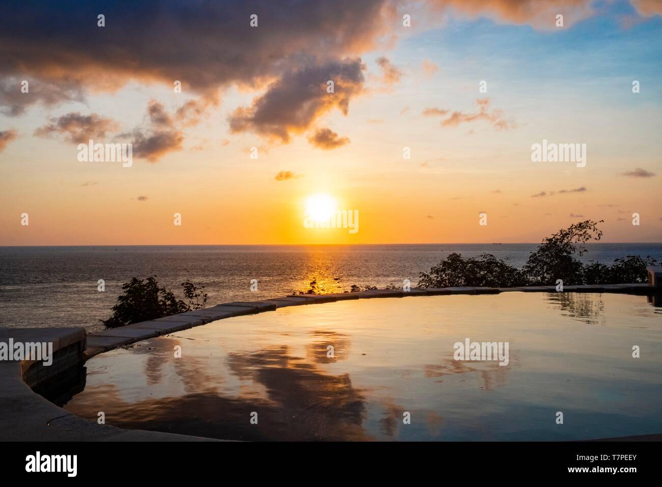 Indonesia, Bali, Amed and East Coast, Aas, swimming pool of a hotel at sunrise Stock Photo