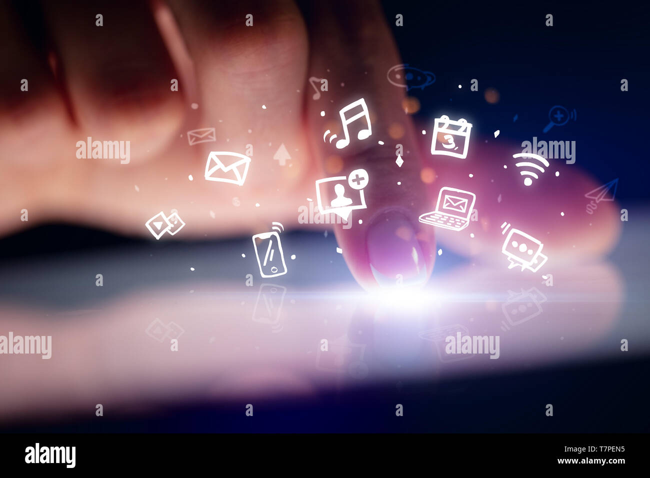 Finger touching tablet with hologram application icons and dark background  Stock Photo