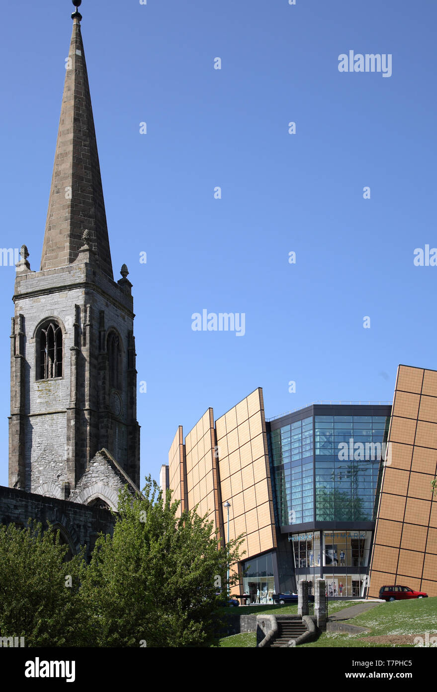 Exterior view of the Drake Circus shopping centre, Plymouth. Shows bombed out Charles Church war memorial in foreground. Stock Photo