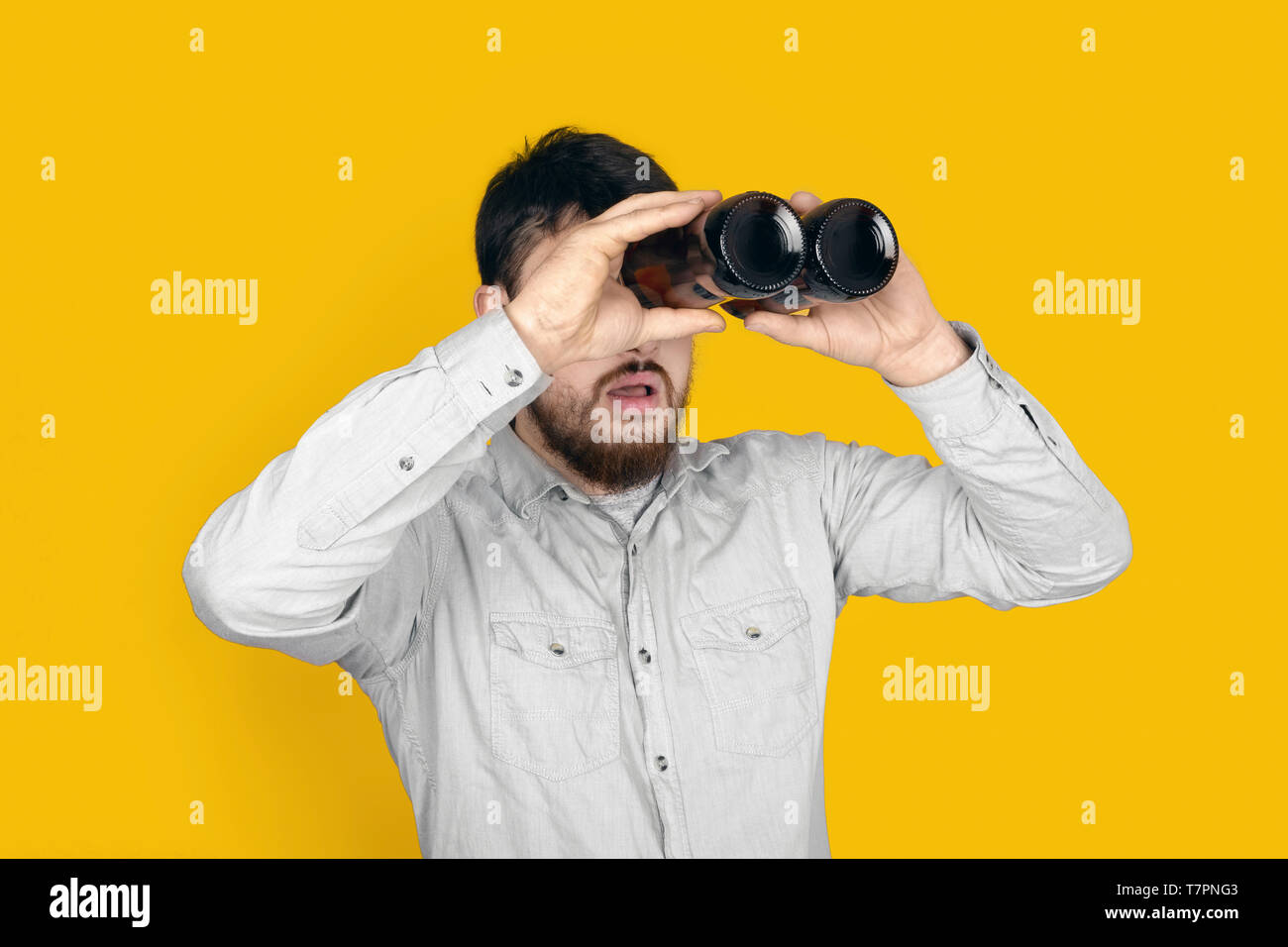 Download Surprised Man With Bottles Of Beer In The Form Of Binoculars Over Yellow Background Stock Photo Alamy PSD Mockup Templates