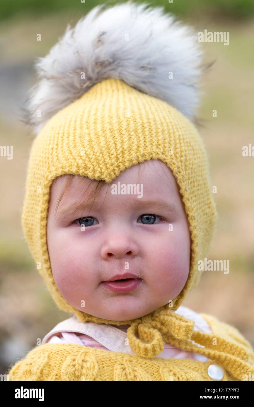 Denmark, Faroe Islands, Eysturoy Island, Gjogv, little girl with a yellow hat Stock Photo