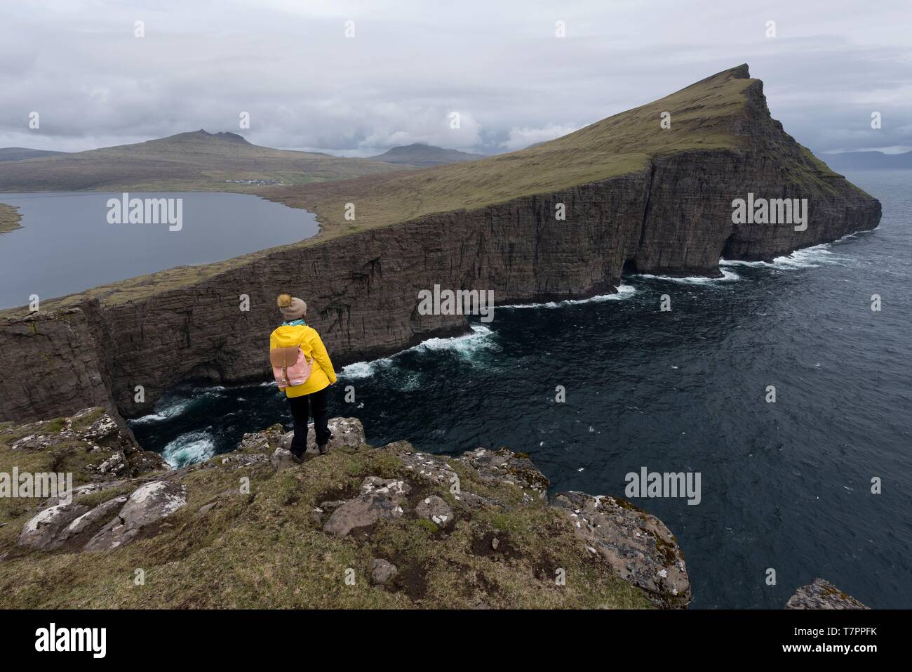 Denmark, Faroe Islands, Vagar Island, Lake Leitisvatn and cliffs Stock Photo