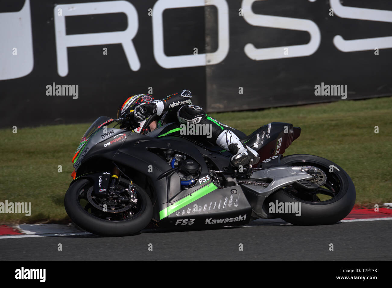 British superbike rider Danny Buchan getting his knee and elbow down at Oulton park Stock Photo