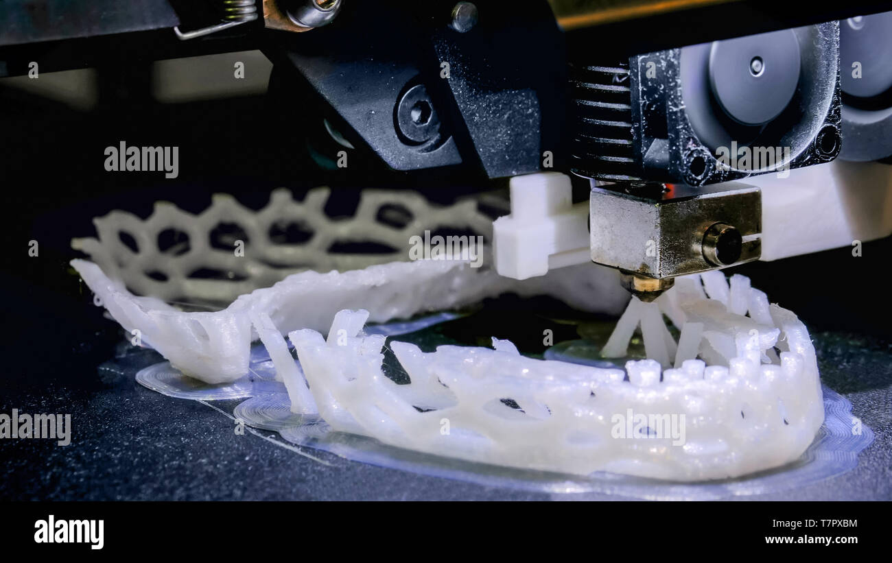 Three dimensional printing machine prints physical 3D model Stock Photo
