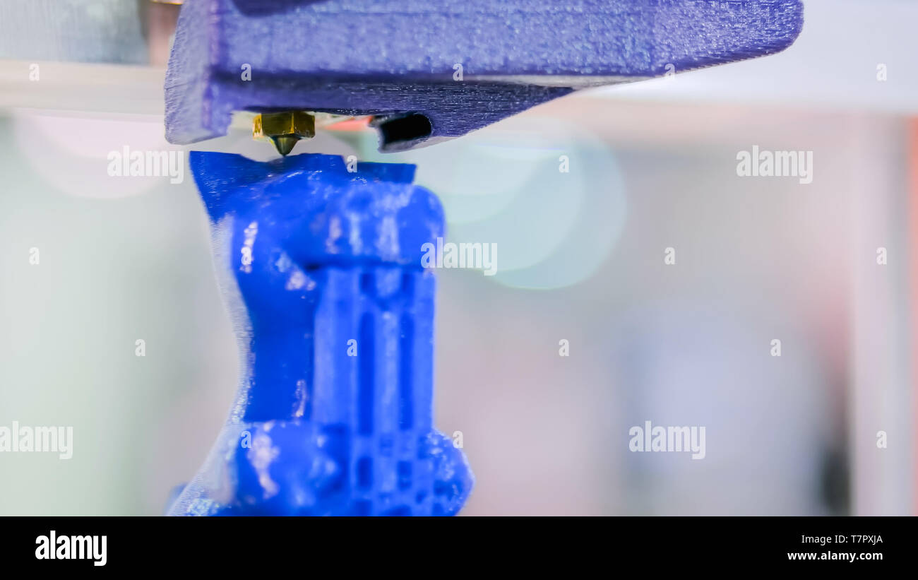 Three dimensional printing machine prints physical 3D model Stock Photo