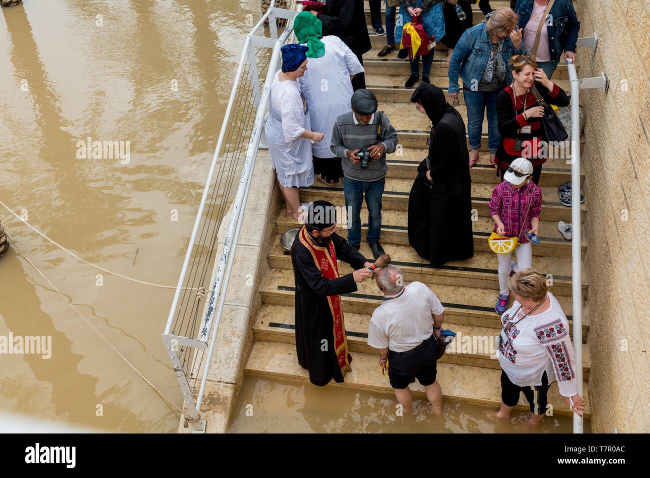 Qasr al Yahud,Israel,26-march-2019:people get baptised where Jesus was baptised by John the Baptist in the Jordan River Stock Photo