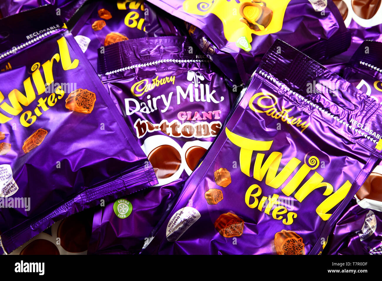 Packets of cadbury twirl,dairy milk giant buttons and caramel nibbles