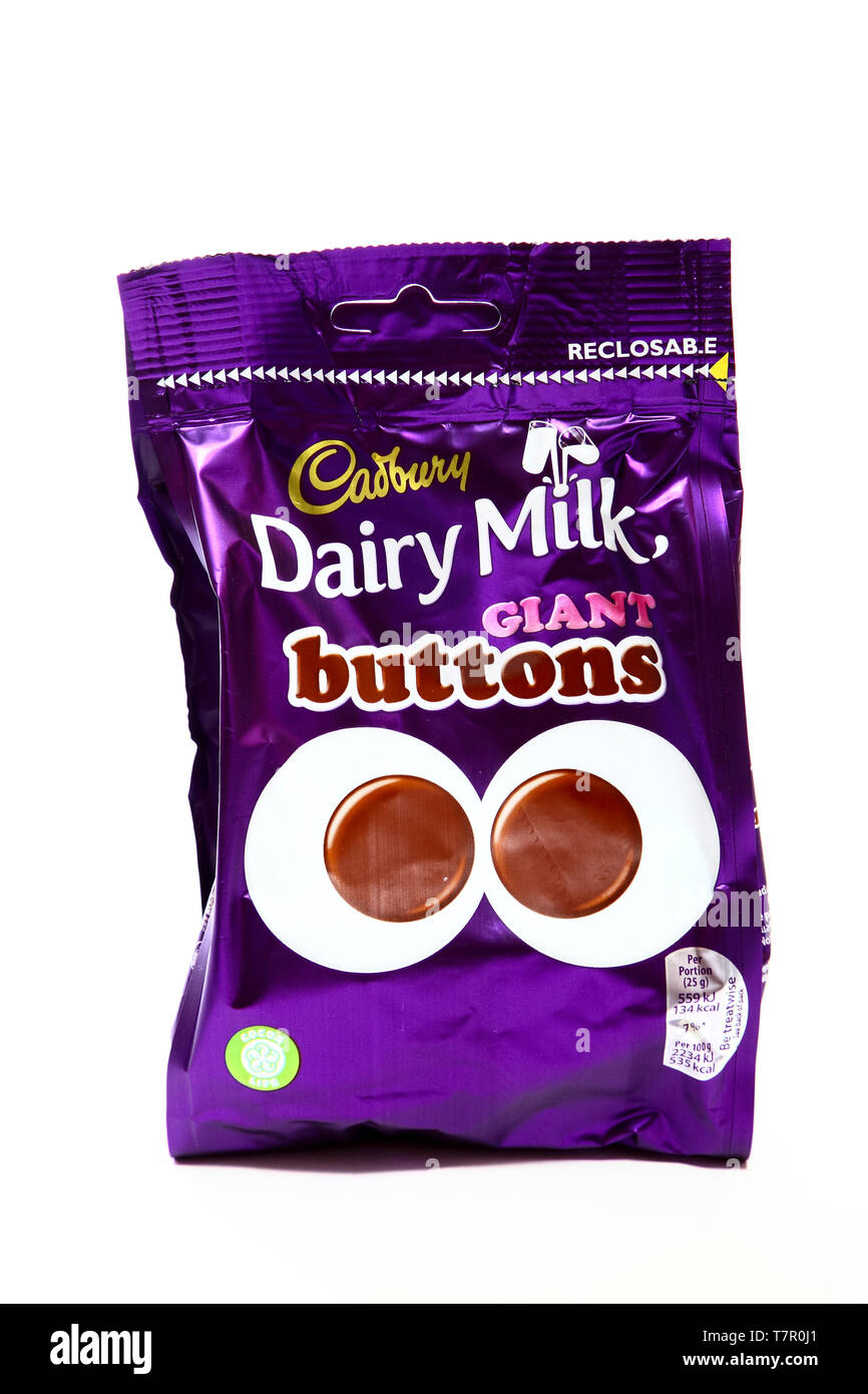 Packet of cadbury dairy milk giant buttons isolated on a white