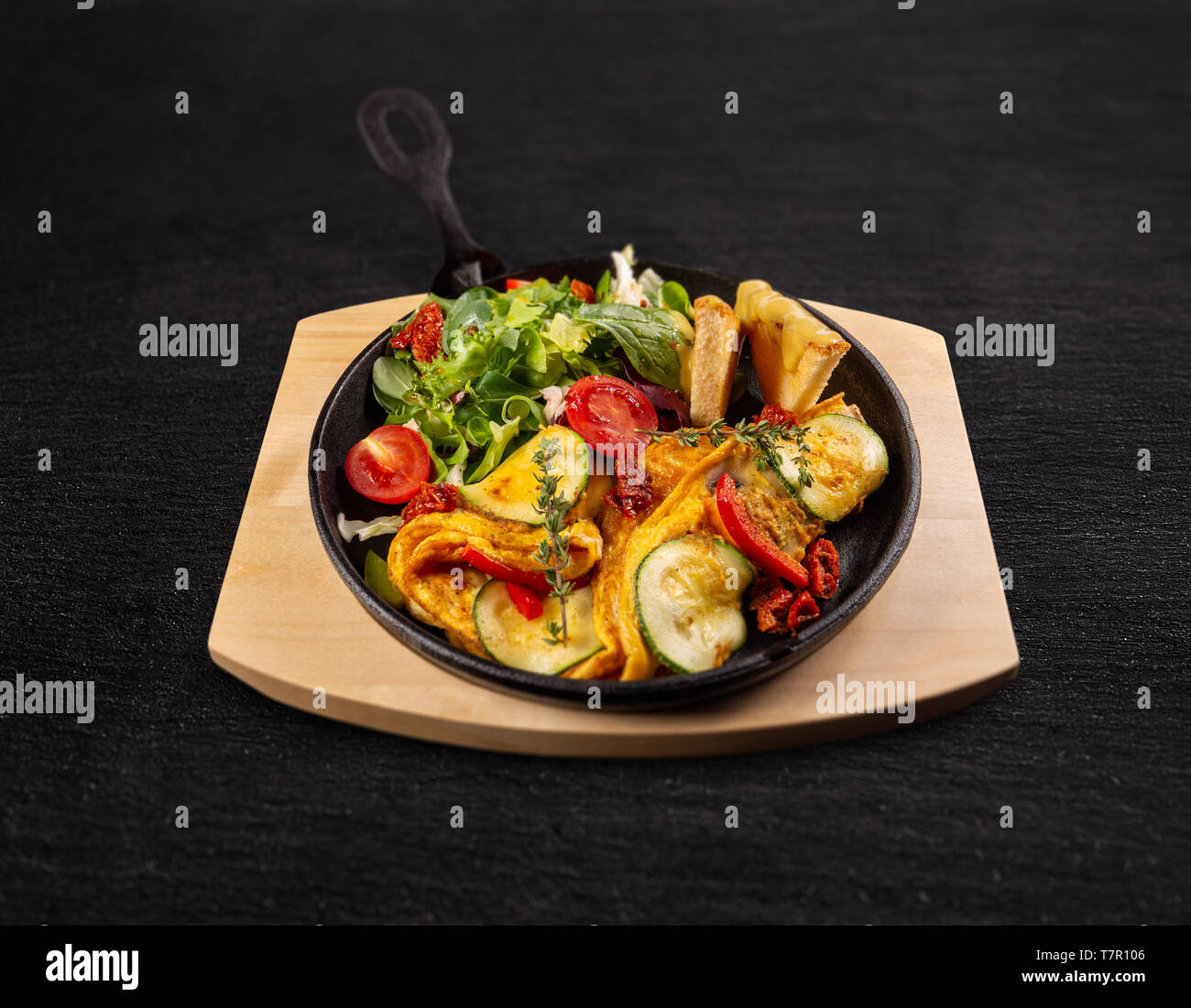 Omelette with veggies and fresh salad, healthy breakfast meal Stock Photo