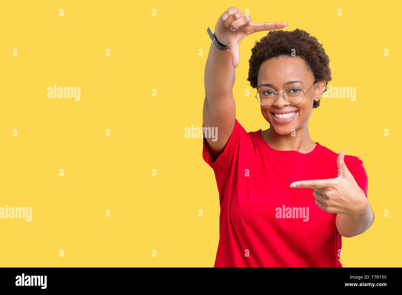 Beautiful young african american woman wearing glasses over isolated ...