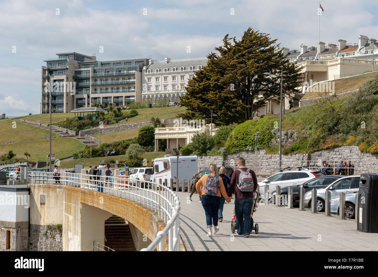 Plymouth, Devon, England, UK. May 2019. People walking on the waterfront with a view of property on The Hoe area of Plymouth UK. Stock Photo