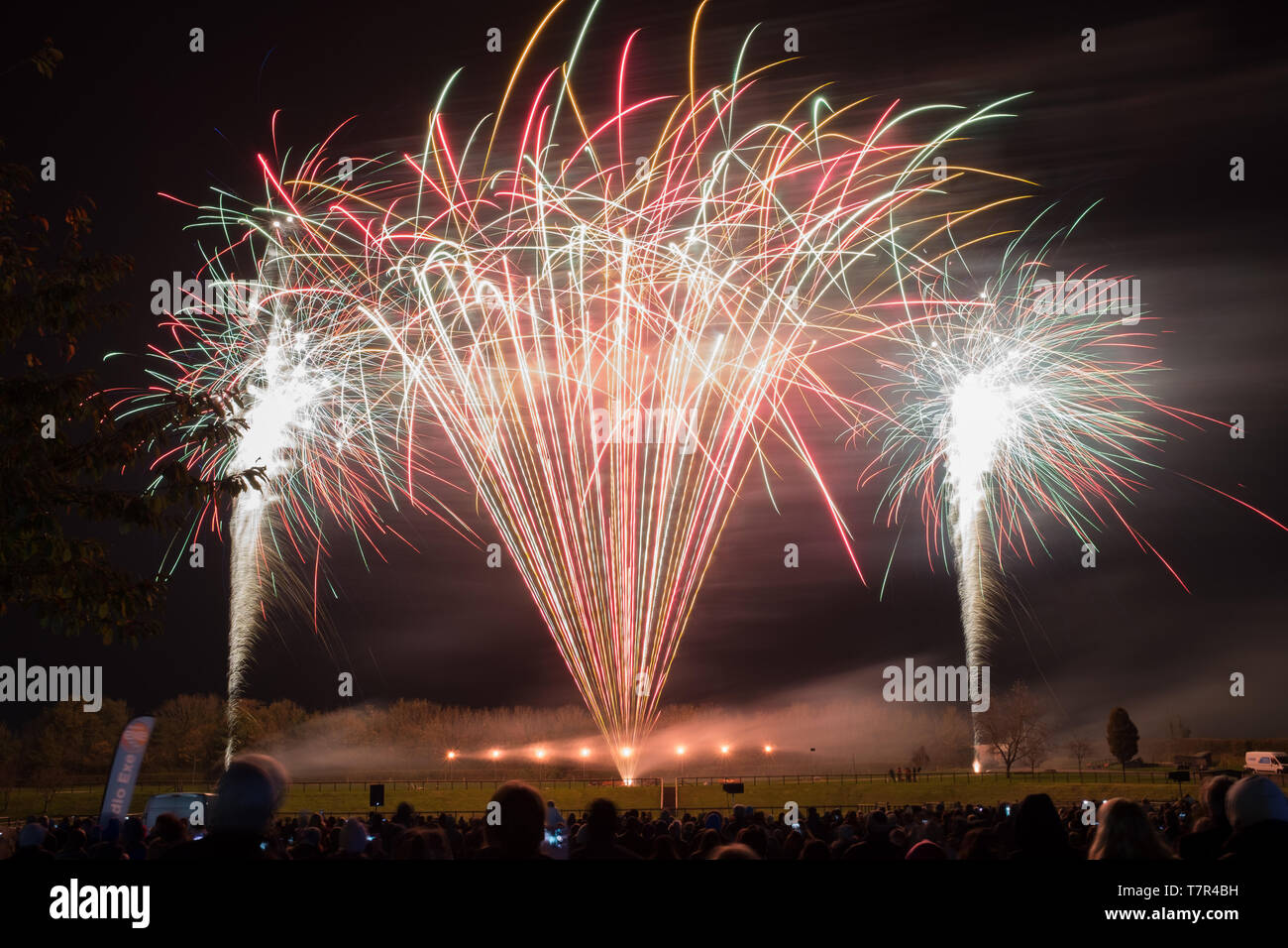 A public firework display in celebration of bonfire night at Westpoint Showgrounds. Exeter, Devon, UK, taken from the back of the crowd Stock Photo