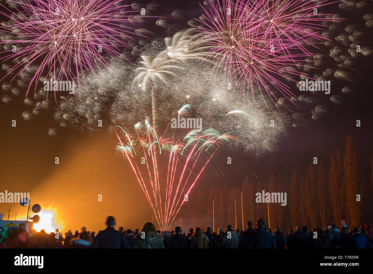 A public firework display in celebration of bonfire night at East Retford, Nottinghamshire, UK, taken from the back of the crowd Stock Photo