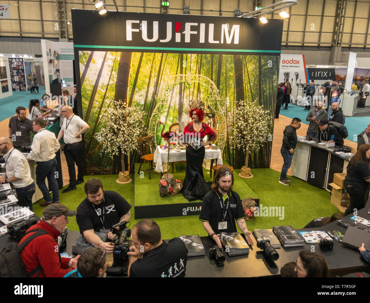 The Photography Show, Birmingham, Uk, March, 17, 2019: Fujifilm one of the major camera vendors provide hands on demos at their stand at the Photography Show, Birmingham, UK with a model centre stage Stock Photo