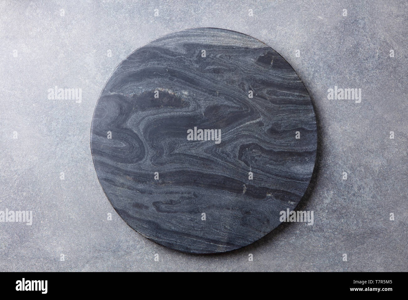 Black marble texture board on grey background. Top view. Copy space. Stock Photo