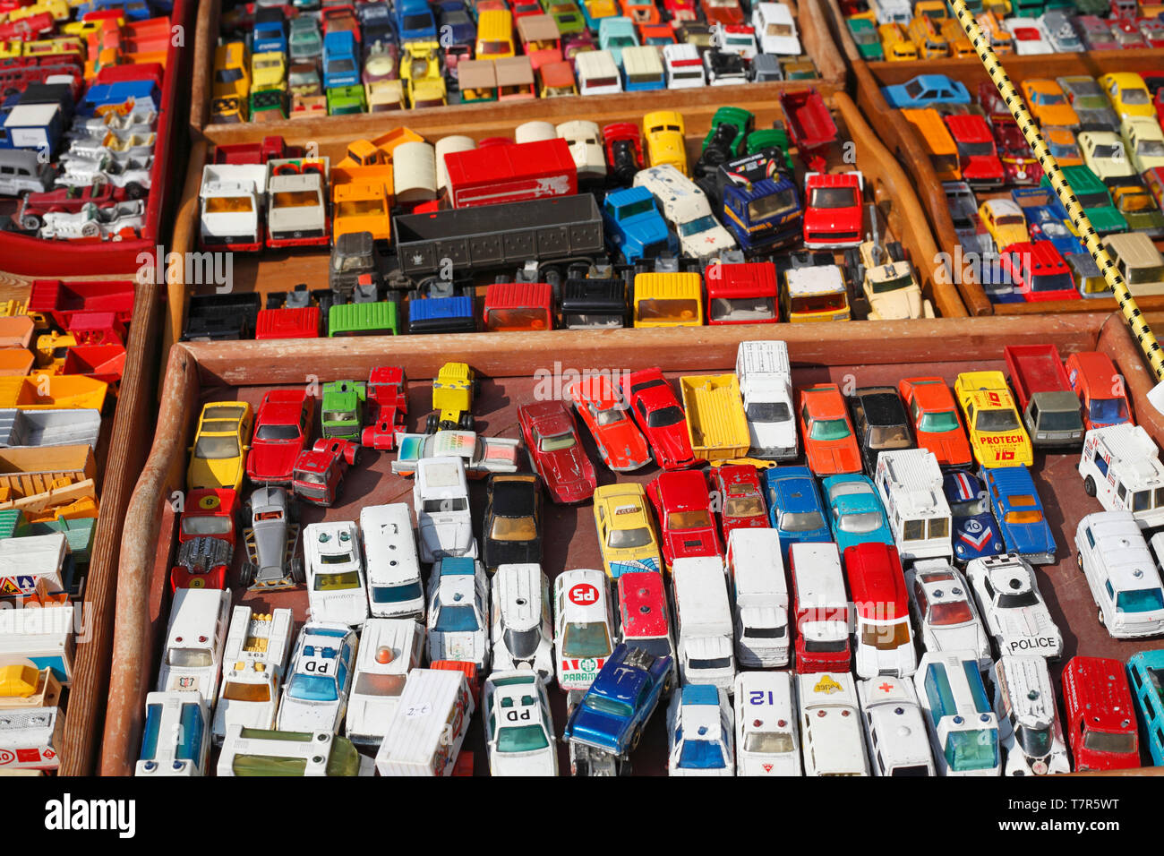 Old colorful toy cars on a flea market, Germany Stock Photo