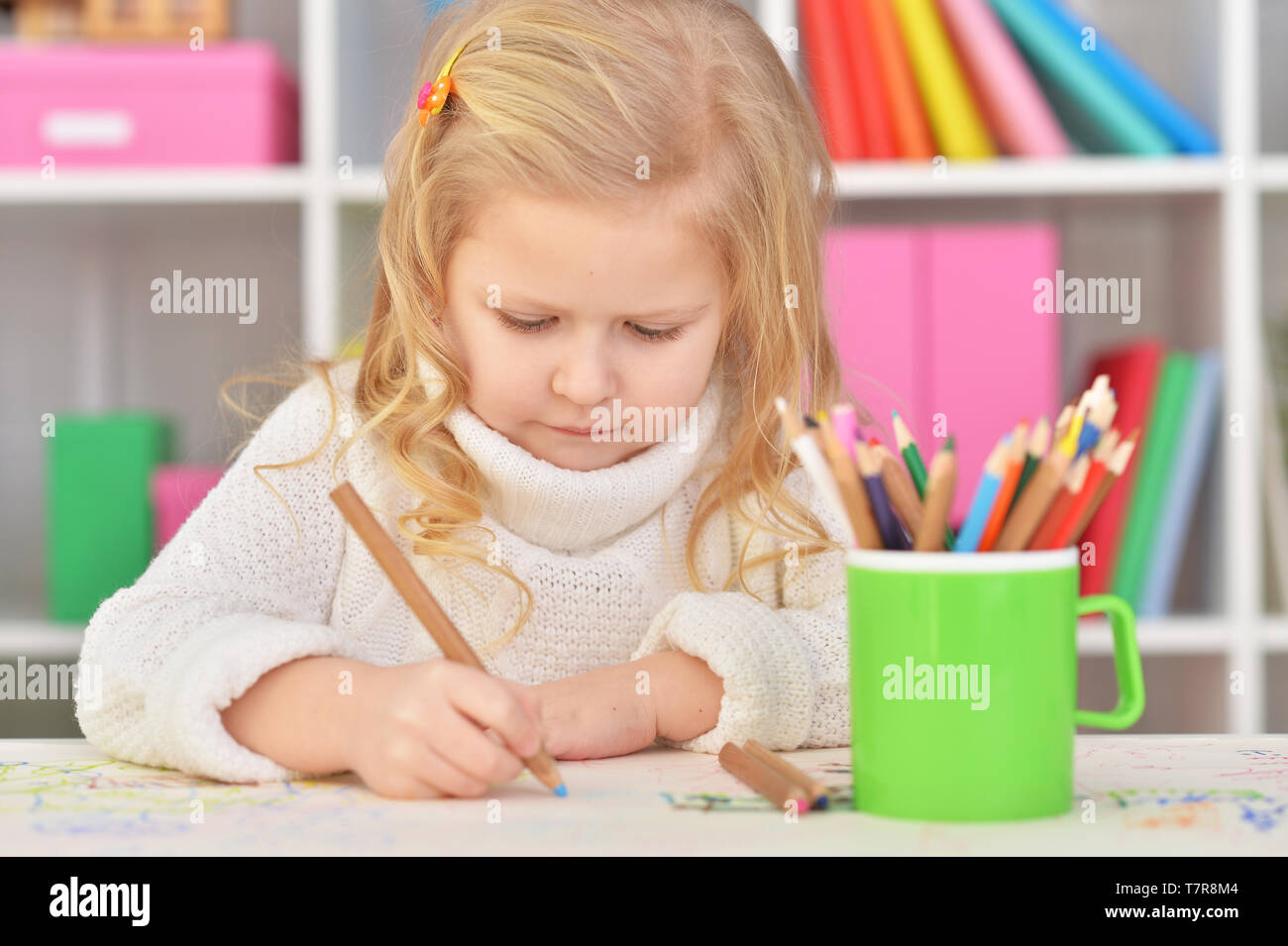 Portrait of little girl drawing with pencil at her room Stock Photo - Alamy